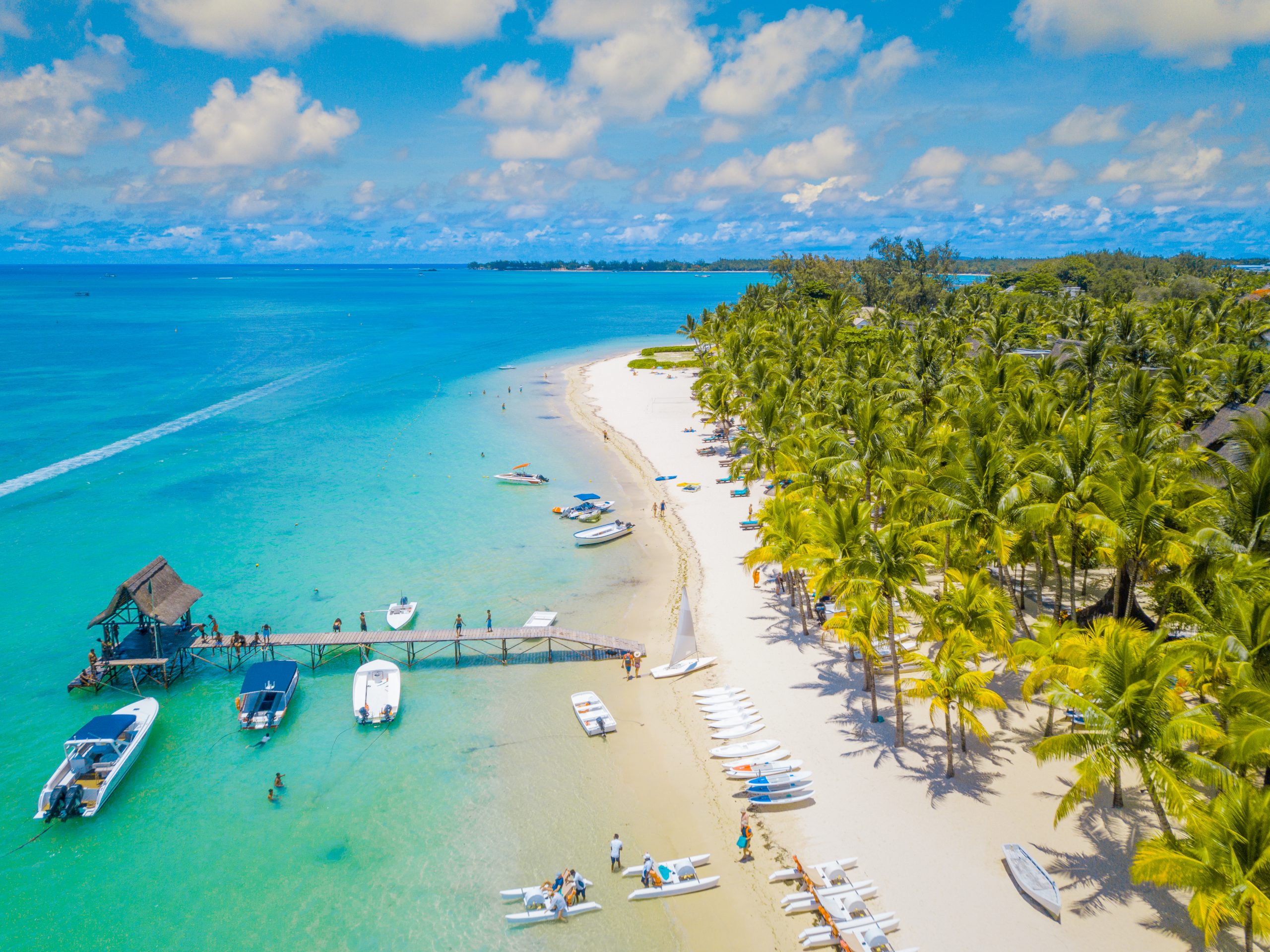 Aerial Trou aux biches.Tropical exotic beach with palms and clear blue water.